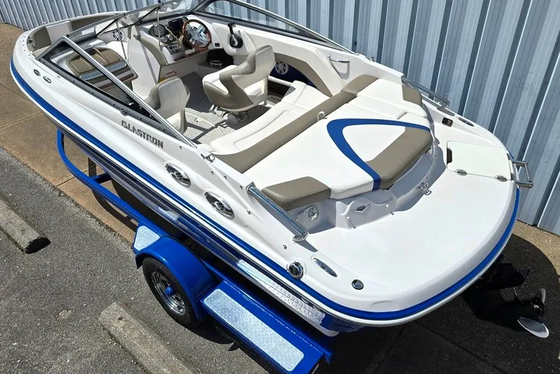 Slide: The Image of 2013 Glastron GLS 195 BR boat on trailer, featuring sleek design and comfortable seating. - 2