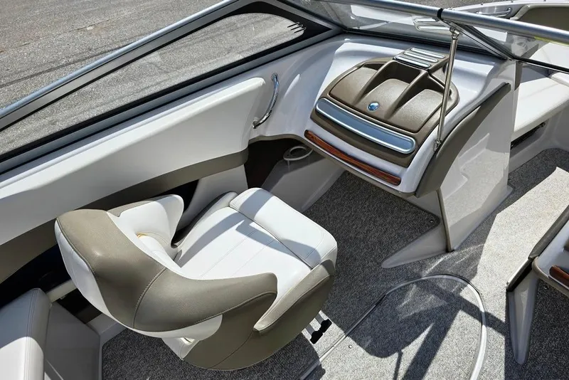 Slide: The Image of 2013 Glastron GLS 195 BR boat interior with modern seating and dashboard design. - 4