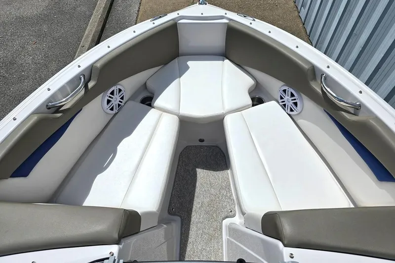 Slide: The Image of 2013 Glastron GLS 195 BR boat interior with white seating and speakers. - 5