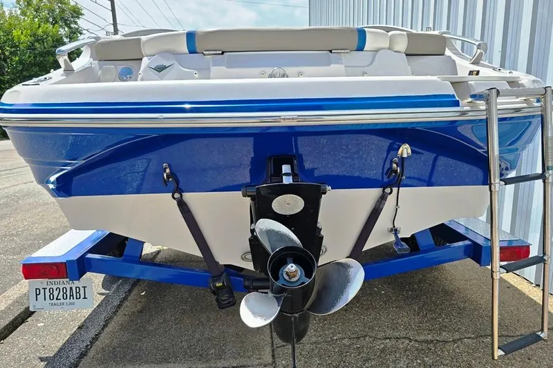 Slide: The Image of 2013 Glastron GLS 195 BR boat on trailer, rear view with propeller and ladder. - 8