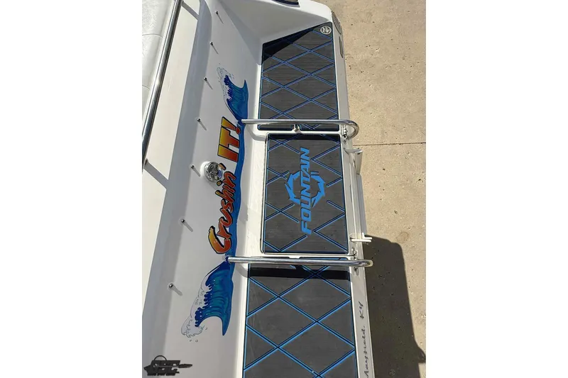 Slide: The Image of 2006 Fountain 47 Lightning boat deck with "Crushin It!" graphic and blue accents. - 15