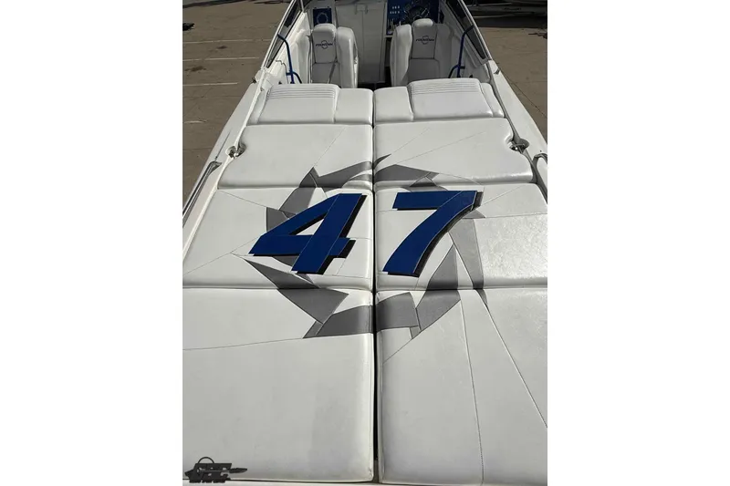 Slide: The Image of 2006 Fountain 47 Lightning boat interior with white seating and blue "47" design. - 17