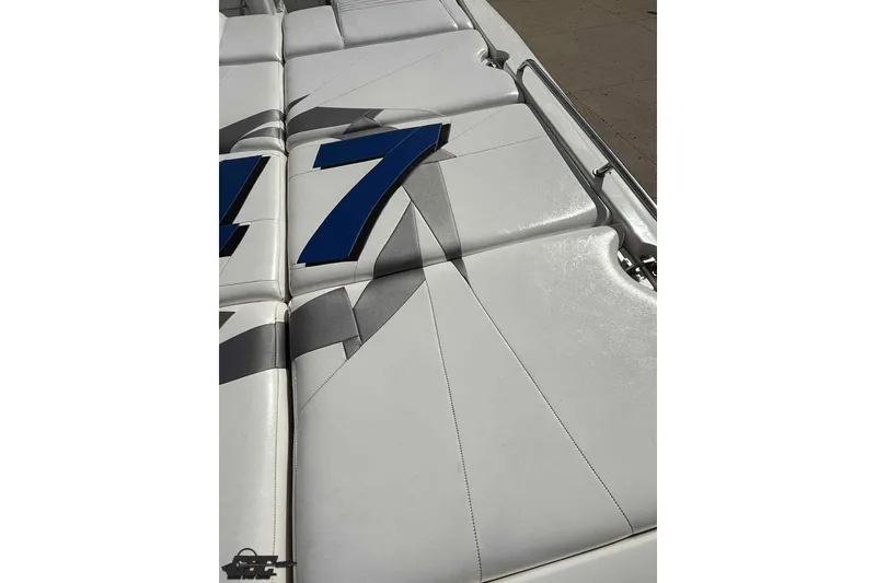 Slide: The Image of 2006 Fountain 47 Lightning boat upholstery with blue number design. - 19