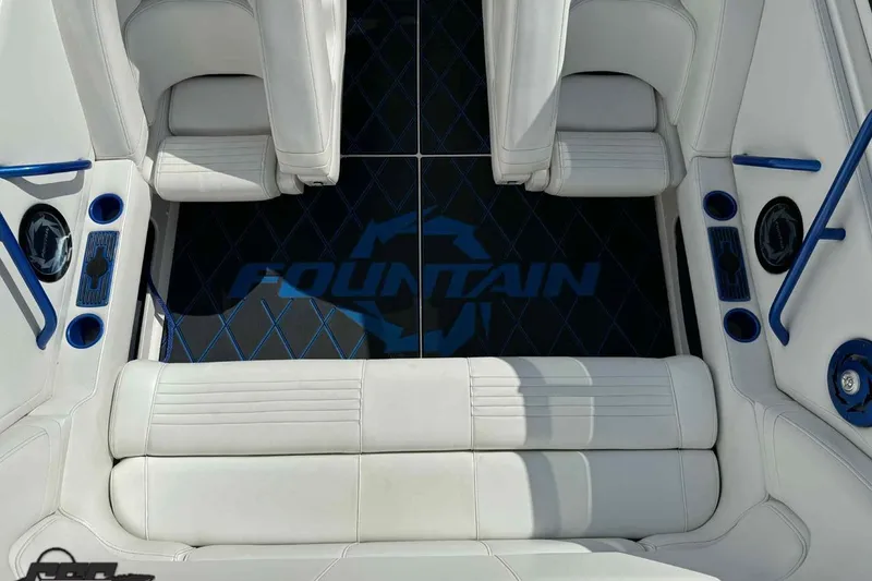 Slide: The Image of Interior of 2006 Fountain 47 Lightning boat with white seating and blue accents. - 23