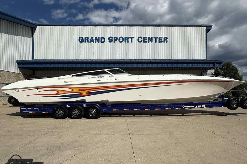 Slide: The Image of 2006 Fountain 47 Lightning boat with vibrant graphics at Grand Sport Center. - 3