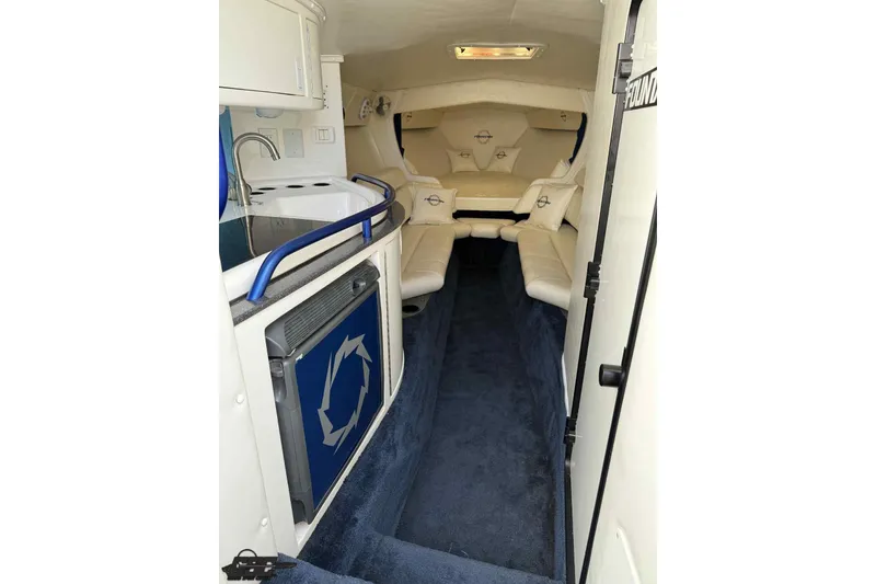 Slide: The Image of 2006 Fountain 47 Lightning boat interior with seating, kitchenette, and modern amenities. - 34