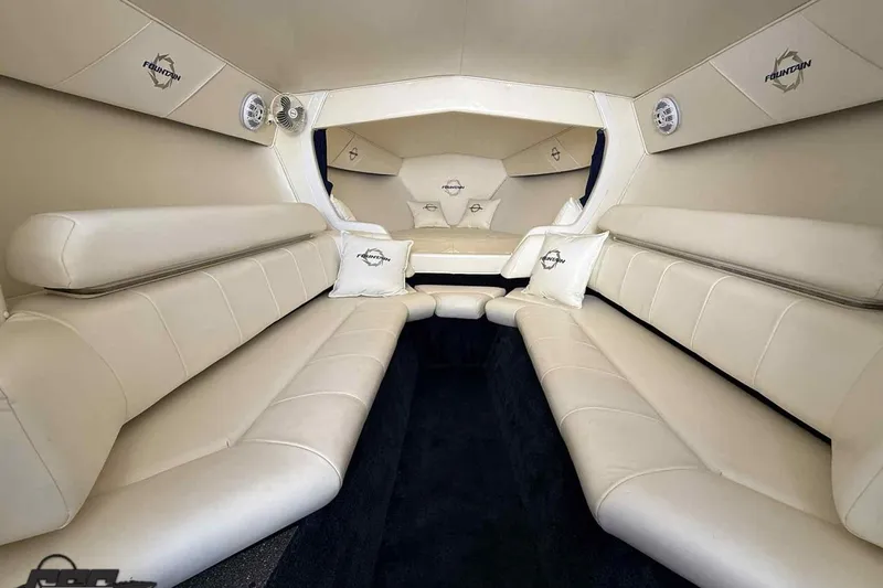 Slide: The Image of Luxurious interior of a 2006 Fountain 47 Lightning boat with cream leather seating. - 35