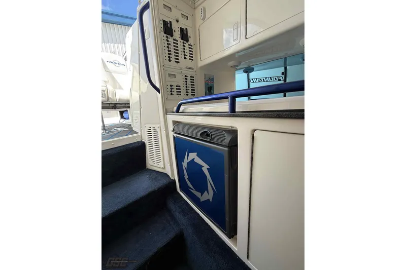 Slide: The Image of Interior of 2006 Fountain 47 Lightning boat with blue accents and cabinetry. - 39