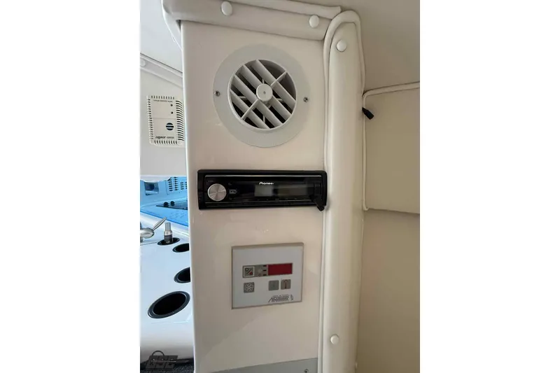 Slide: The Image of Interior of 2006 Fountain 47 Lightning boat with audio system and control panel. - 40