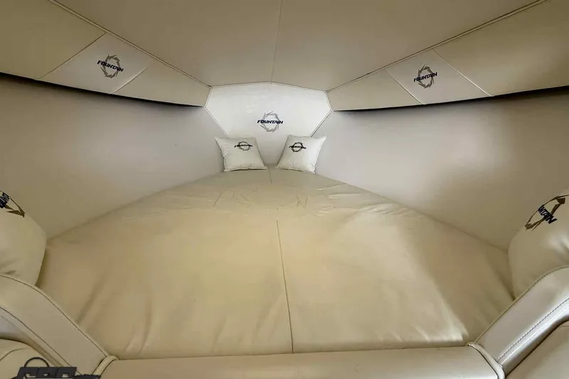Slide: The Image of Interior cabin of 2006 Fountain 47 Lightning boat with branded cushions and sleek design. - 42