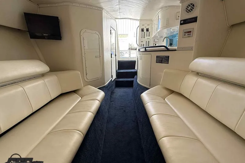 Slide: The Image of Interior of 2006 Fountain 47 Lightning boat with beige seating and modern amenities. - 43