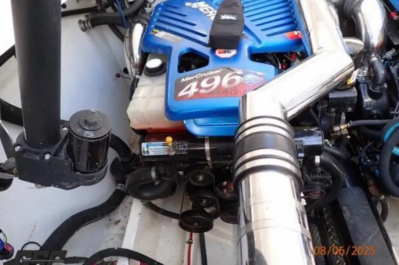 Slide: The Image of 2006 Fountain 47 Lightning engine, featuring a MerCruiser 496 MAG, in a boat's engine compartment. - 48