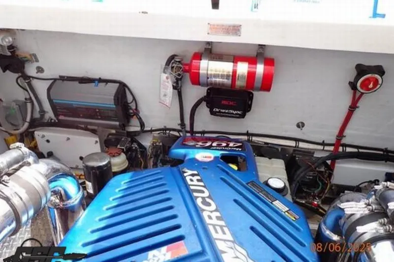 Slide: The Image of Engine compartment of a 2006 Fountain 47 Lightning boat with Mercury engine components. - 49