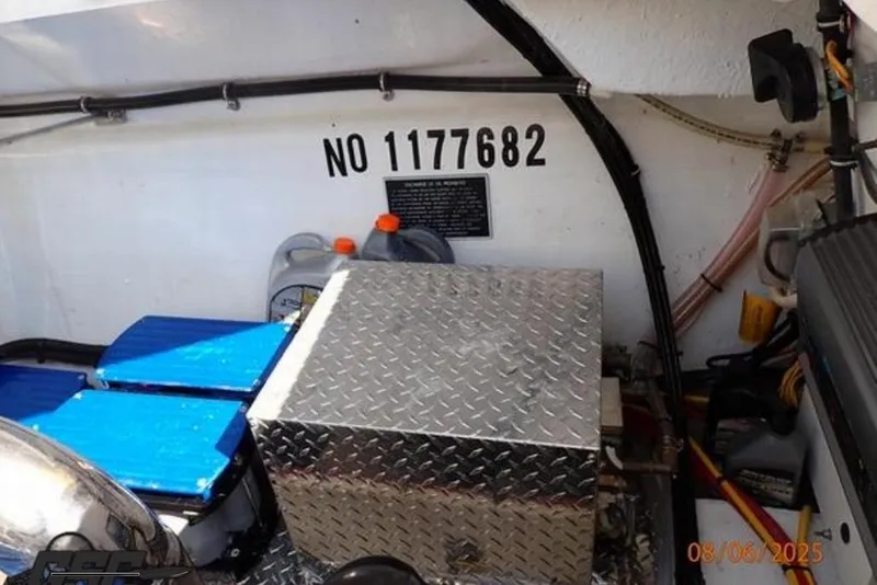 Slide: The Image of Engine compartment of 2006 Fountain 47 Lightning boat with equipment and serial number. - 51