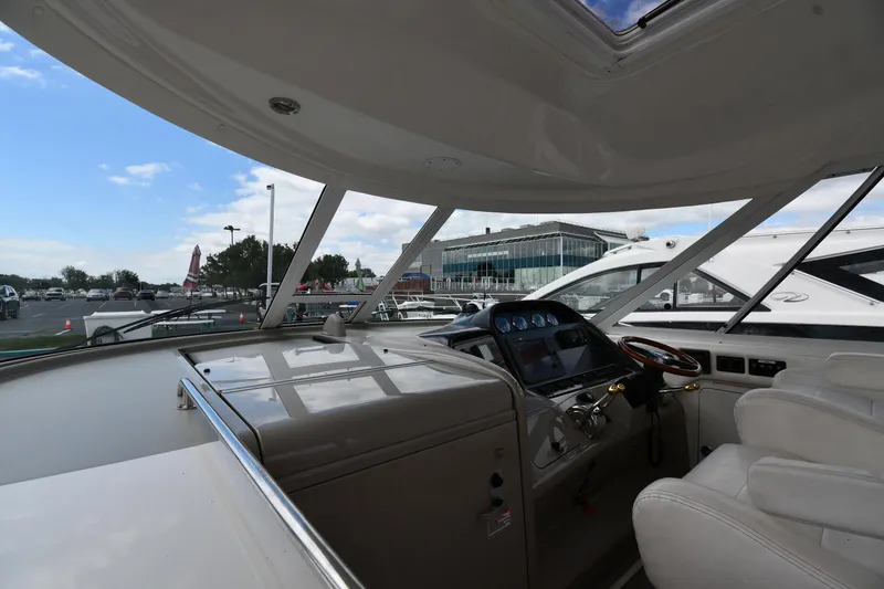 Slide: The Image of Interior view of 2005 Sea Ray 390 Motor Yacht cockpit with steering wheel and controls. - 11