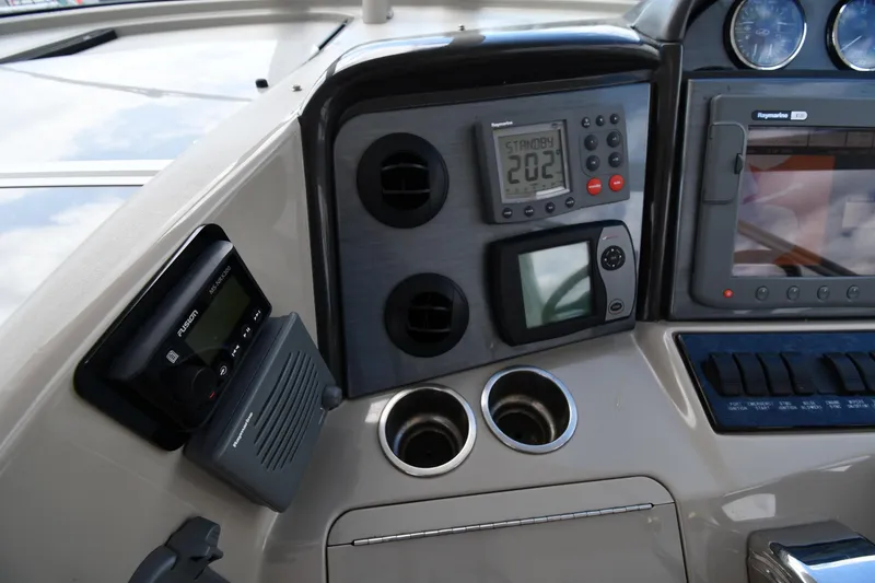 Slide: The Image of Control panel of a 2005 Sea Ray 390 Motor Yacht with navigation instruments. - 13