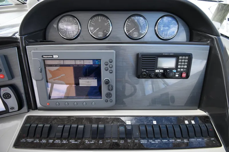 Slide: The Image of Control panel of 2005 Sea Ray 390 Motor Yacht with navigation and communication systems. - 14
