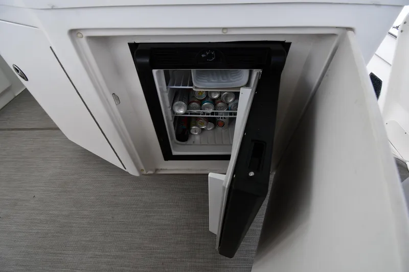 Slide: The Image of Mini fridge stocked with beverages on 2005 Sea Ray 390 Motor Yacht. - 23