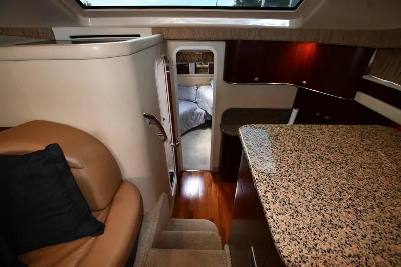 Slide: The Image of Luxurious interior of 2005 Sea Ray 390 Motor Yacht with granite countertops and cozy seating. - 25