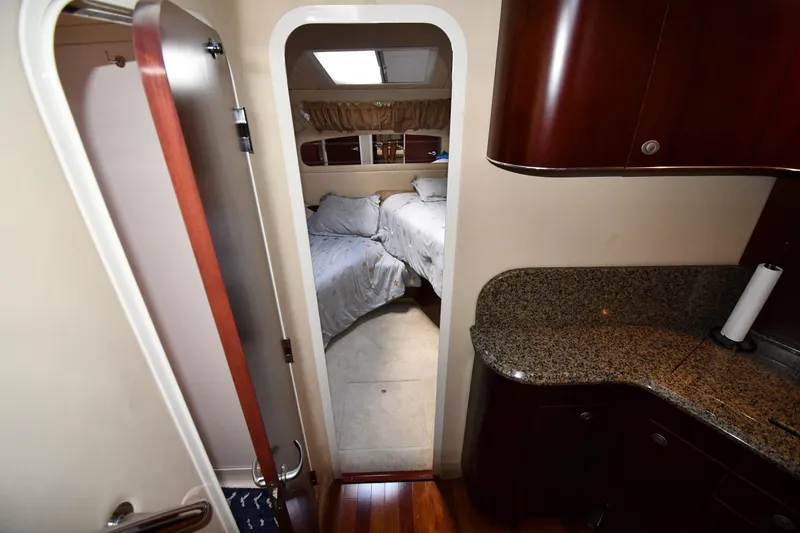 Slide: The Image of Interior of 2005 Sea Ray 390 Motor Yacht with bedroom and granite countertop. - 26