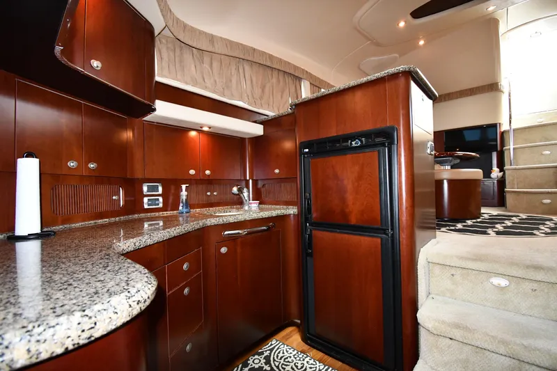 Slide: The Image of Luxurious interior of 2005 Sea Ray 390 Motor Yacht with elegant wood cabinetry and modern amenities. - 40