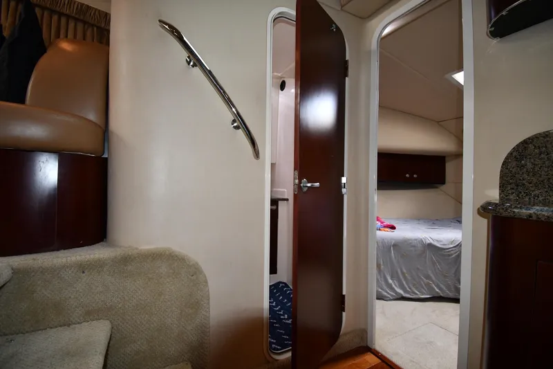 Slide: The Image of Interior view of 2005 Sea Ray 390 Motor Yacht, featuring stairs and bedroom entrance. - 42