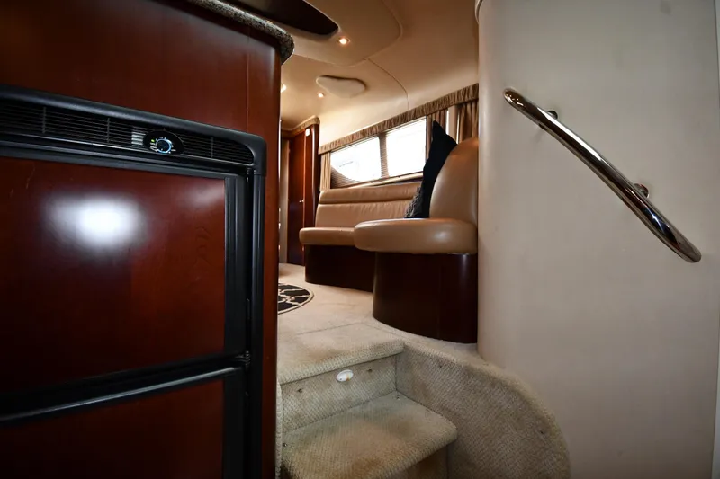 Slide: The Image of Interior of 2005 Sea Ray 390 Motor Yacht with stairs, seating, and wood finishes. - 43