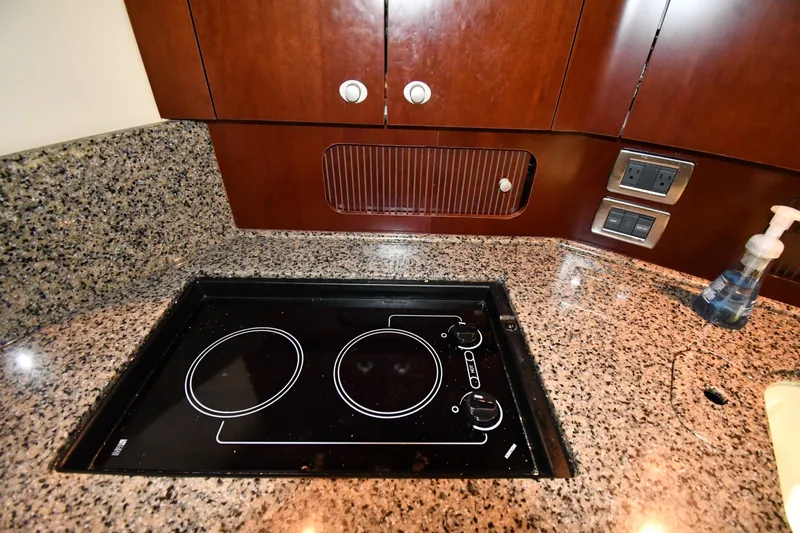 Slide: The Image of Granite countertop with electric stove in 2005 Sea Ray 390 Motor Yacht kitchen. - 45