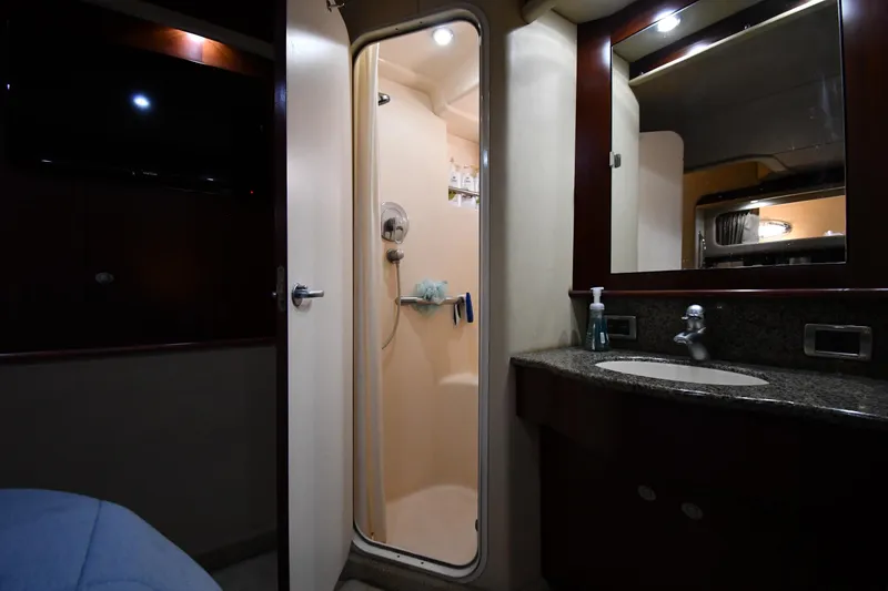 Slide: The Image of 2005 Sea Ray 390 Motor Yacht bathroom with shower, sink, and mirror. - 56