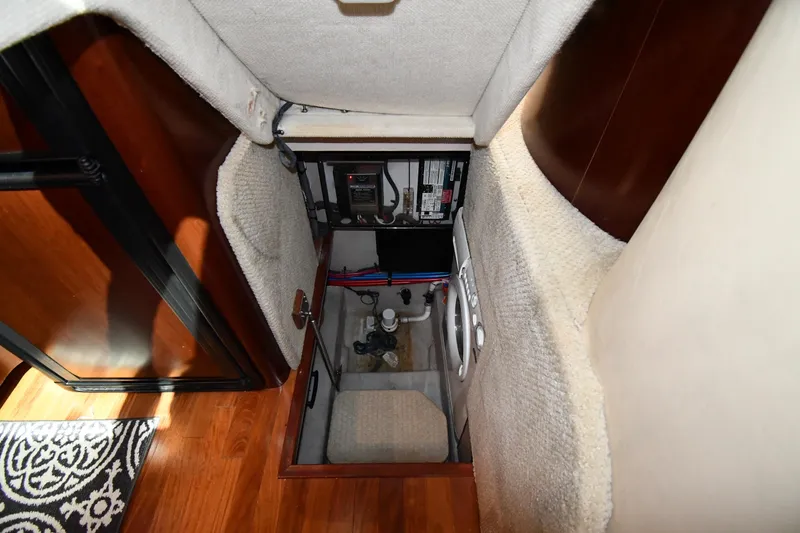 Slide: The Image of 2005 Sea Ray 390 Motor Yacht interior with open hatch and visible equipment. - 57