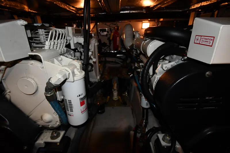 Slide: The Image of Engine room of 2005 Sea Ray 390 Motor Yacht, showcasing mechanical components and systems. - 60