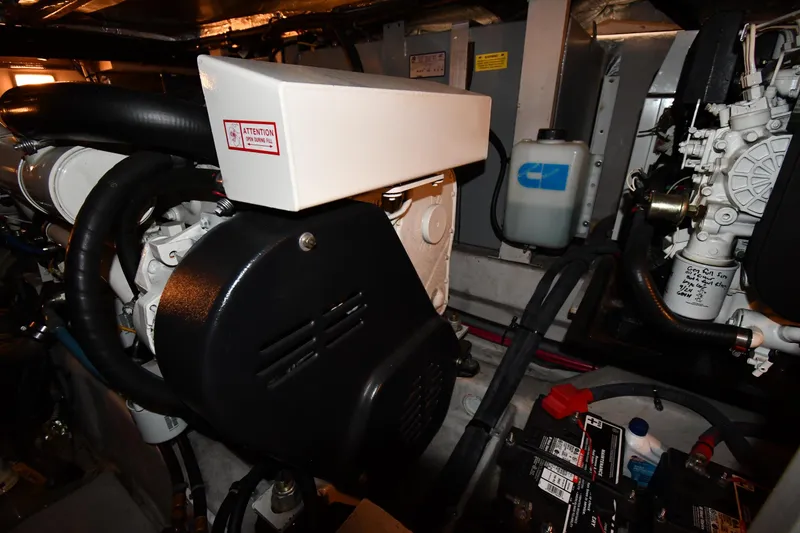 Slide: The Image of Engine room of 2005 Sea Ray 390 Motor Yacht with visible components and wiring. - 61