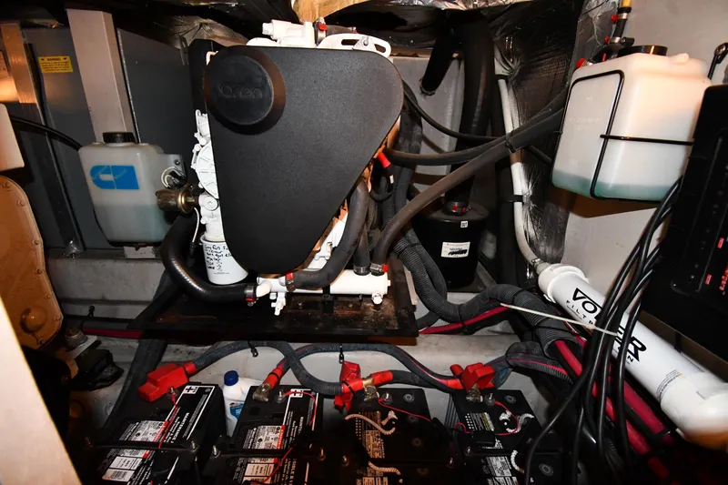 Slide: The Image of Engine room of 2005 Sea Ray 390 Motor Yacht with batteries and mechanical components. - 64