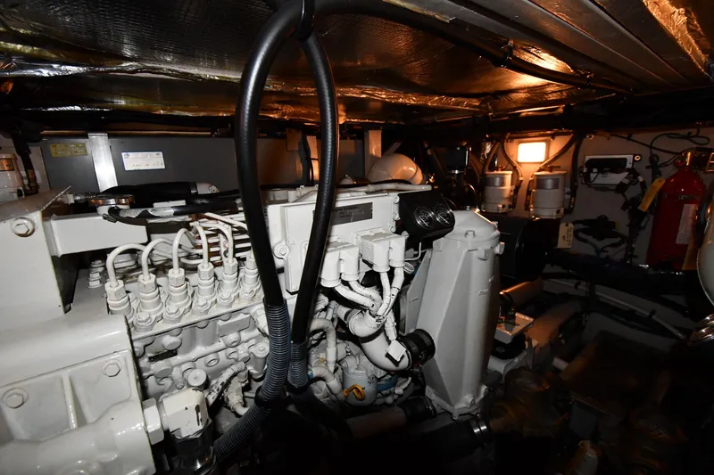 Slide: The Image of Engine room of 2005 Sea Ray 390 Motor Yacht, showcasing mechanical components and equipment. - 66