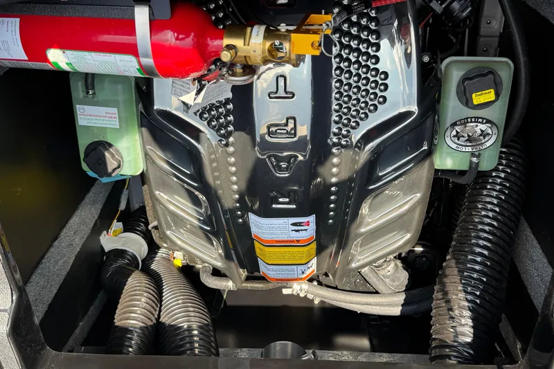 Slide: The Image of Engine compartment of 2026 Supra SE 550 with fire extinguisher and fluid reservoirs. - 15