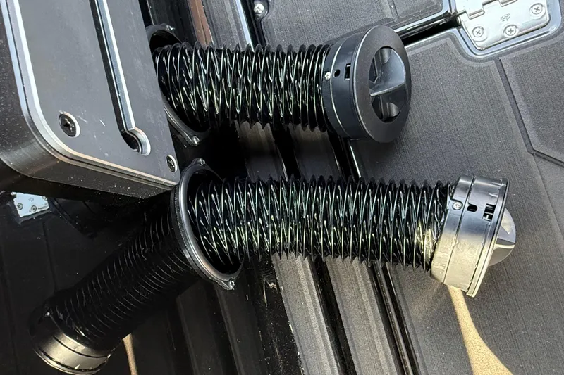 Slide: The Image of Close-up of Supra SE 550 2026 boat exhaust system with black flexible hoses. - 17