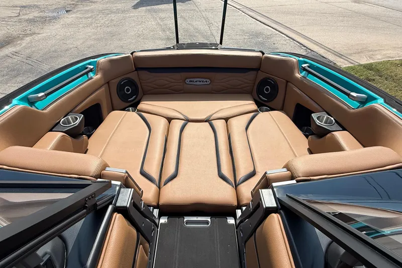 Slide: The Image of Luxurious interior of 2026 Supra SE 550 boat with tan seating and modern design. - 22