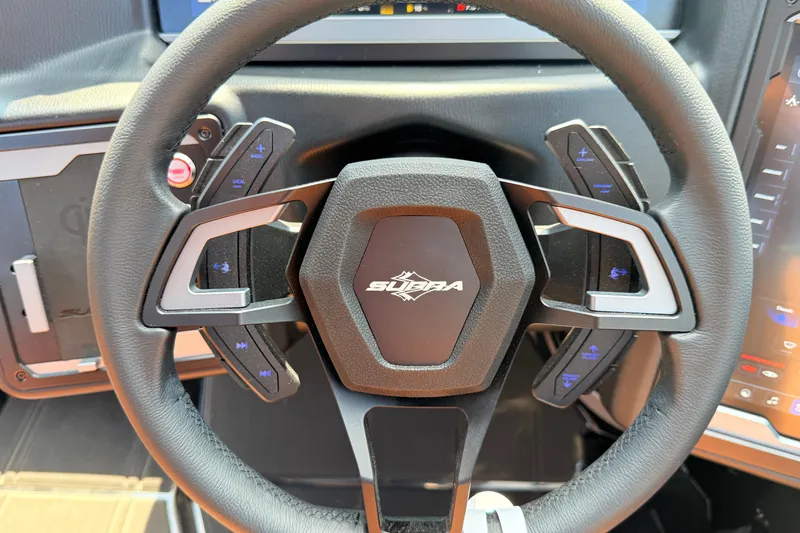 Slide: The Image of Steering wheel of 2026 Supra SE 550 with integrated controls and modern design. - 23