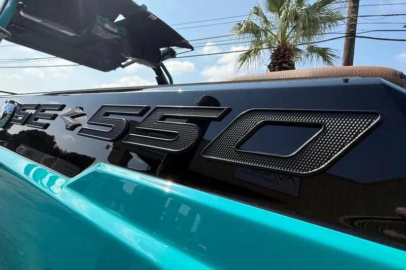 Slide: The Image of 2026 Supra SE 550 boat with sleek design and bold branding. - 6