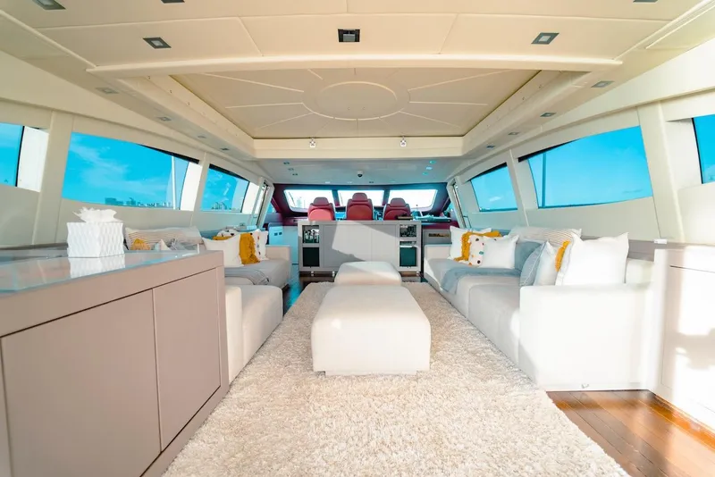 Slide: The Image of Luxurious interior of a 2007 Mangusta 92 yacht with plush seating and panoramic windows. - 25