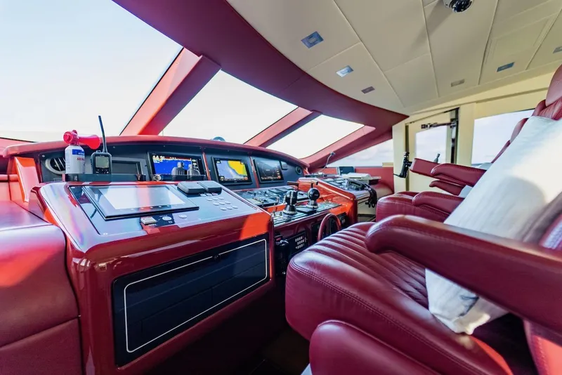 Slide: The Image of Luxurious 2007 Mangusta 92 yacht cockpit with red leather seats and advanced navigation systems. - 26