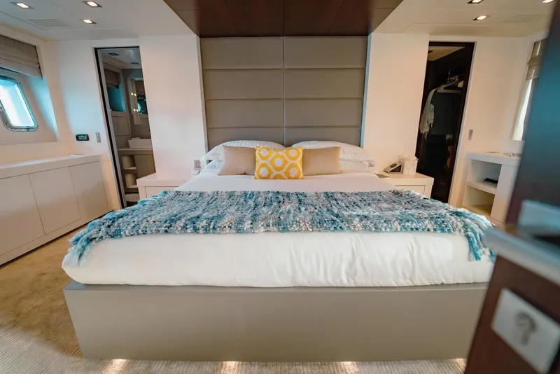 Slide: The Image of Luxurious bedroom interior on 2007 Mangusta 92 yacht with modern decor and cozy bedding. - 32