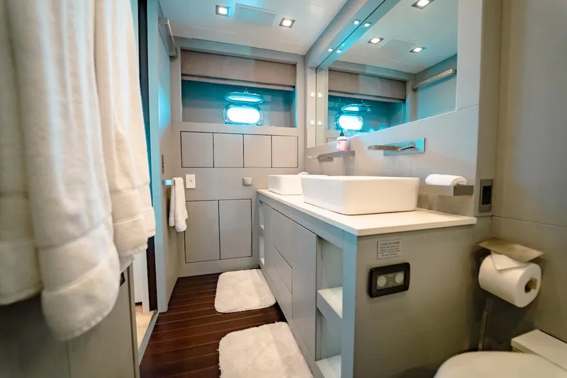 Slide: The Image of Luxurious bathroom in a 2007 Mangusta 92 yacht, featuring modern fixtures and elegant design. - 36
