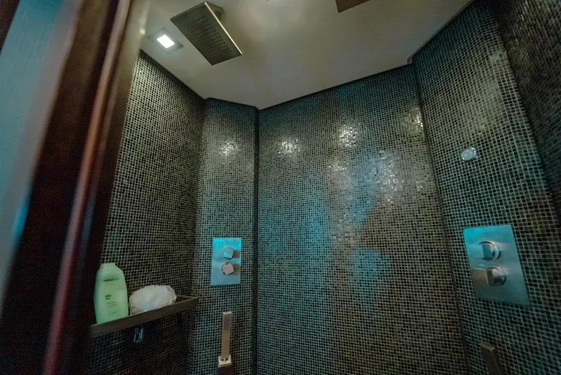 Slide: The Image of Luxurious shower with mosaic tiles in a 2007 Mangusta 92 yacht. - 41