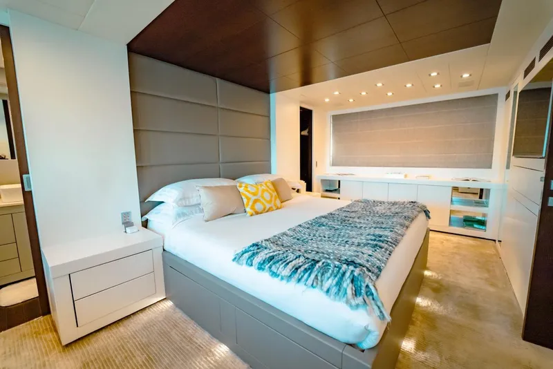 Slide: The Image of Luxurious bedroom interior on 2007 Mangusta 92 yacht, featuring modern design and cozy bedding. - 43
