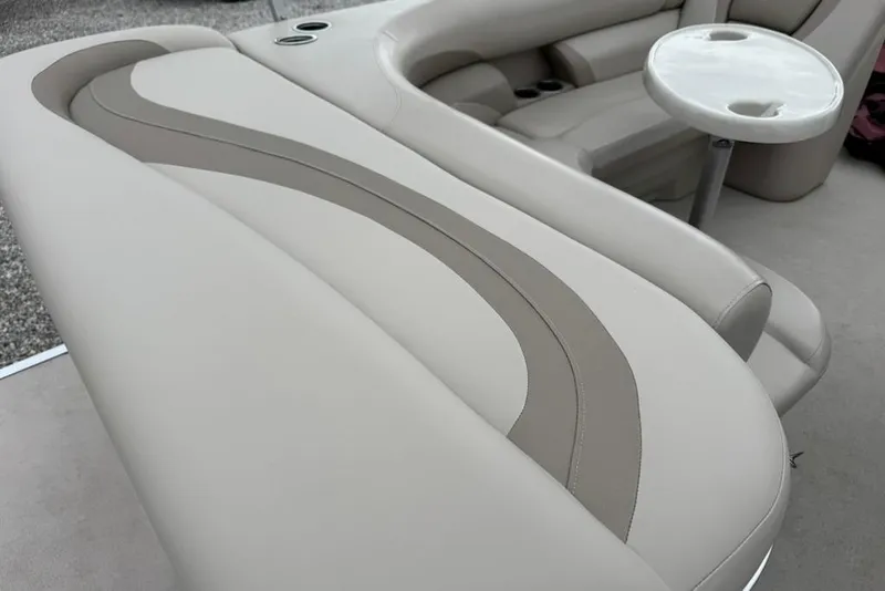 Slide: The Image of 2017 Starcraft EX 20 RDP boat interior with beige seating and a small round table. - 12