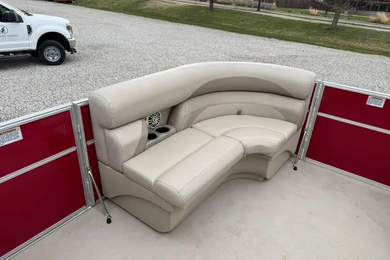 Slide: The Image of 2017 Starcraft EX 20 RDP pontoon boat with beige seating and red paneling. - 13