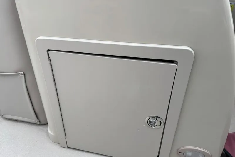 Slide: The Image of 2017 Starcraft EX 20 RDP boat storage compartment with lockable door. - 15