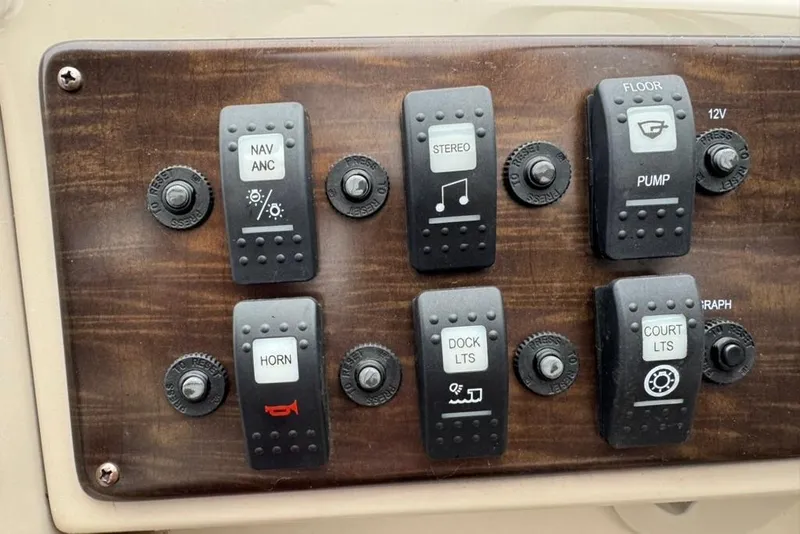 Slide: The Image of Control panel of a 2017 Starcraft EX 20 RDP boat with various switches. - 16