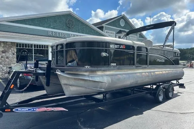 The Image of 2017 Manitou 23 Oasis pontoon boat on trailer at Reeds Marine dealership. - 0